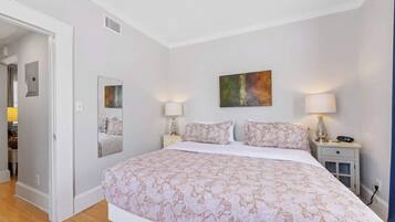 1 bedroom, desk, iron/ironing board, travel crib