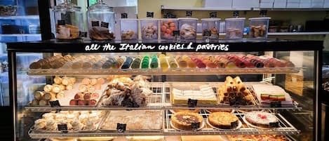 A display case with various Italian cookies and pastries.