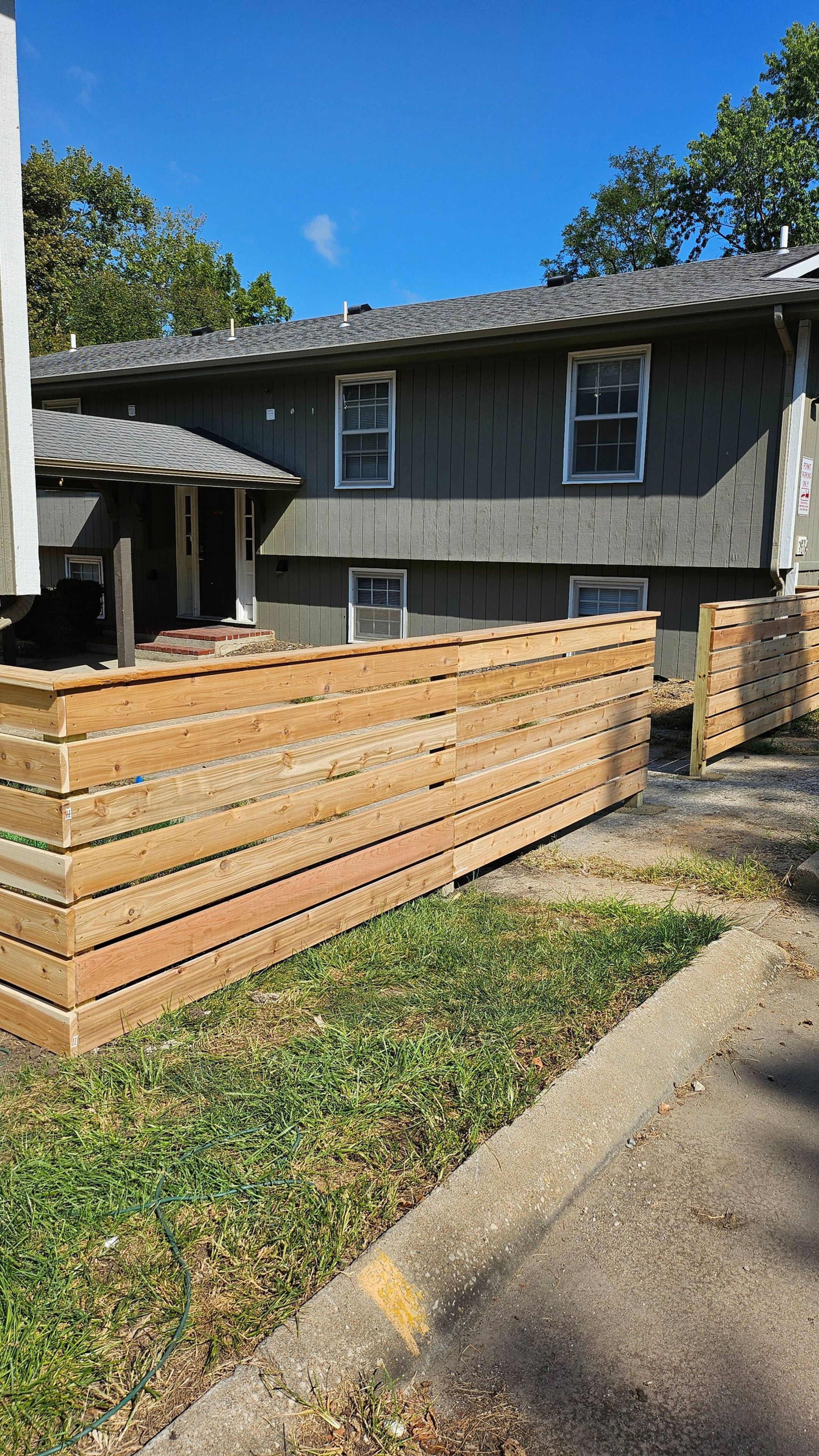 Wood privacy fence and building exterior