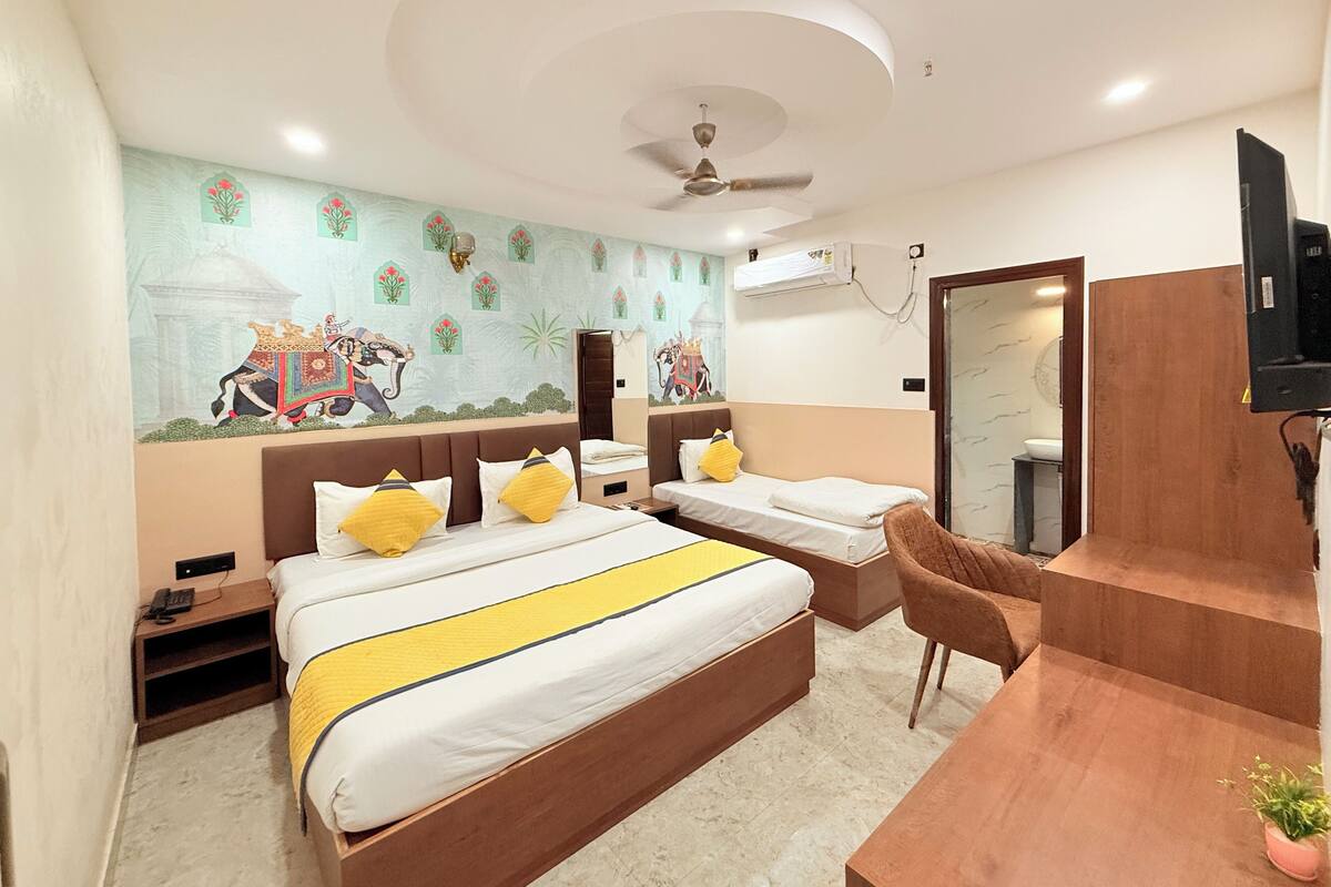 Deluxe Triple Room | Laptop workspace, iron/ironing board (on request), WiFi (free)