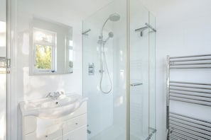Shower, hair dryer, towels, toilet paper