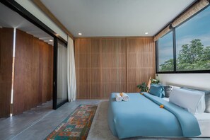 A modern bedroom with a large bed, a view of the outdoors, and a wooden panel wall. - Stylish 2BR Villa Private Pool (Kuta Utara)
