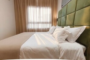 2 habitaciones, tabla de planchar con plancha, wifi y ropa de cama 