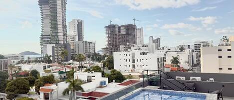 Family Room, Balcony, City View | City view