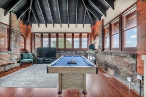 Game room - Urban Industrial Penthouse | Game Room Pool Table (Cleveland)