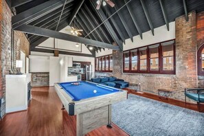 Game room - Urban Industrial Penthouse | Game Room Pool Table (Cleveland)