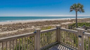 A wooden deck with a view of the beach and ocean. - Surf Shack | Water Park | Ocean Lakes (Horry County)