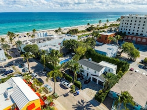 A coastal hotel with a pool, beach access, and a parking lot. - Beachfront by Boardwalk/Heated Pool/Gameroom - N (Hollywood)