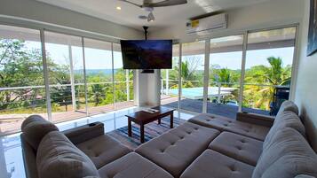 Family Villa, Balcony, Pool View | Living area