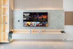 Deluxe Apartment, Balcony, City View | Living area | 40-inch LED TV with satellite channels