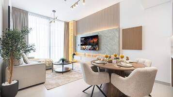 Deluxe Apartment, Balcony, City View | Living area | 40-inch LED TV with satellite channels