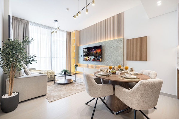 Deluxe Apartment, Balcony, City View | Living area | 40-inch LED TV with satellite channels