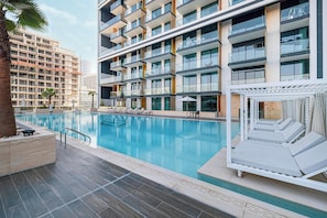 Outdoor pool, pool umbrellas, pool loungers