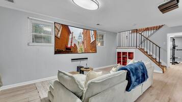 Smart TV, fireplace, books, computer monitors