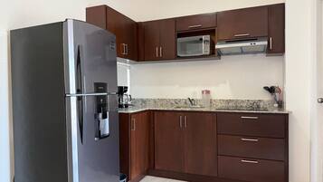 Fridge, microwave, stovetop, coffee/tea maker