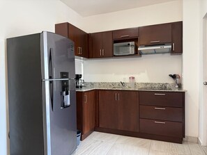 Fridge, microwave, stovetop, coffee/tea maker