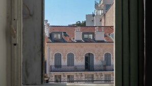 A view of a building with a tiled roof and arched windows through an open door. - Top Floor Studio – Heart of Cannes (Cannes)