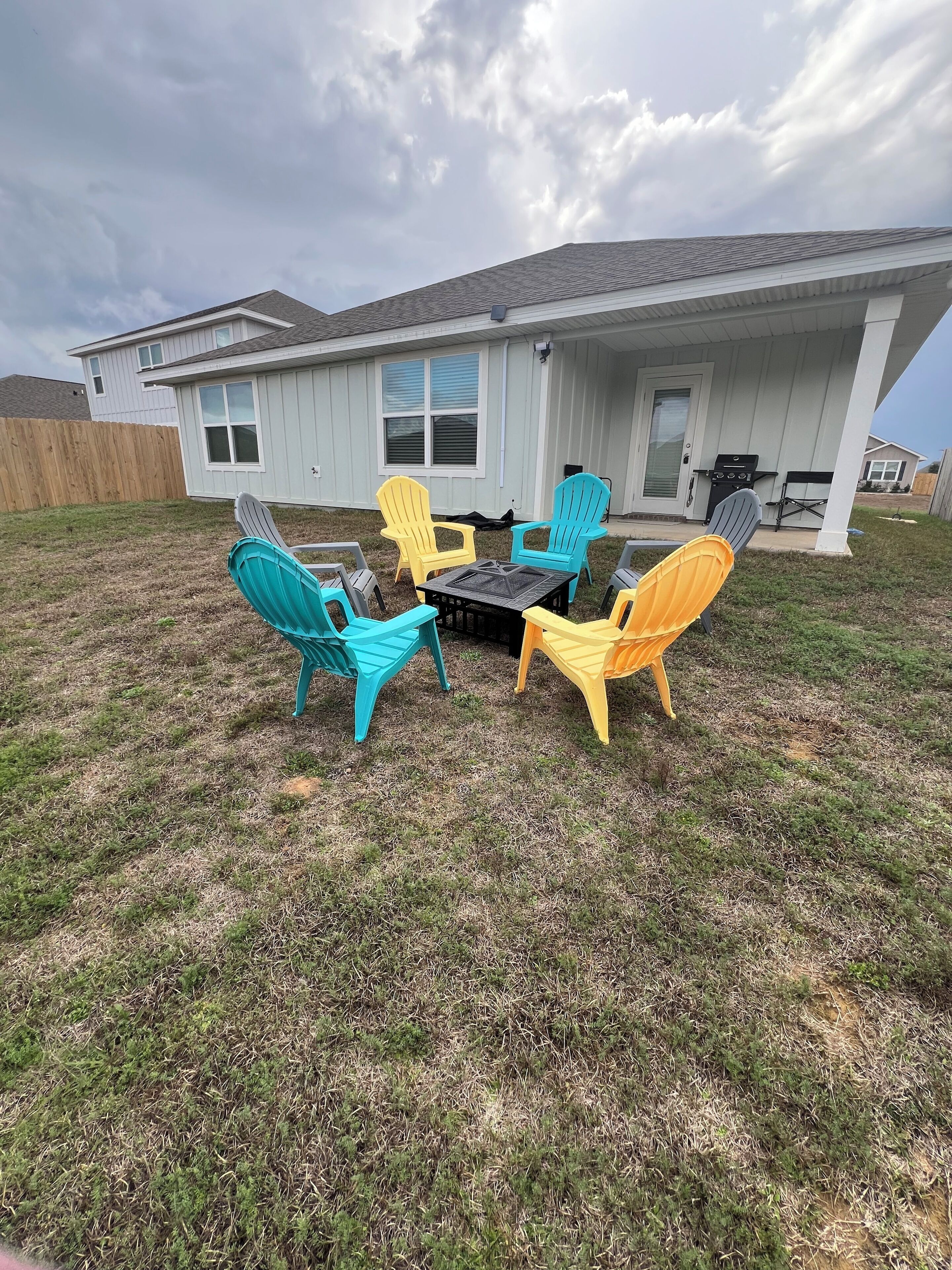 A house with a patio area featuring outdoor furniture.