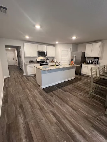 Fridge, microwave, oven, stovetop. Welcoming Spacious Crestview Home w/ Pool Access & Fire Pit