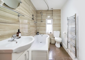 Hair dryer, towels, shampoo, toilet paper