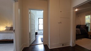 A room with a bed, a small table, and a window. - Snowhawk House in Historic Wallace located close to many outdoor adventures! (Wallace)