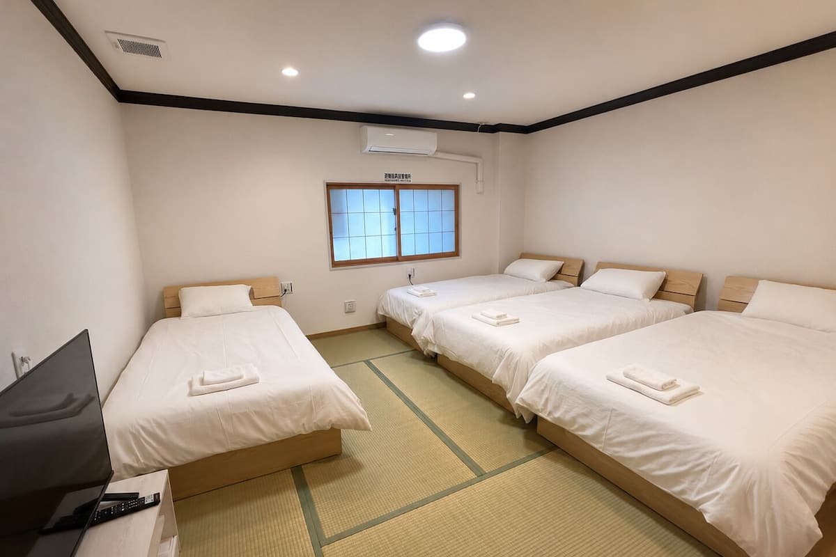 Standard Quadruple Room, Multiple Beds, Non Smoking | Desk, iron/ironing board (on request), WiFi (free), bed sheets