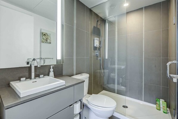 Shower, hair dryer, towels, soap