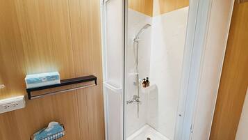 Shower, hair dryer, towels, shampoo