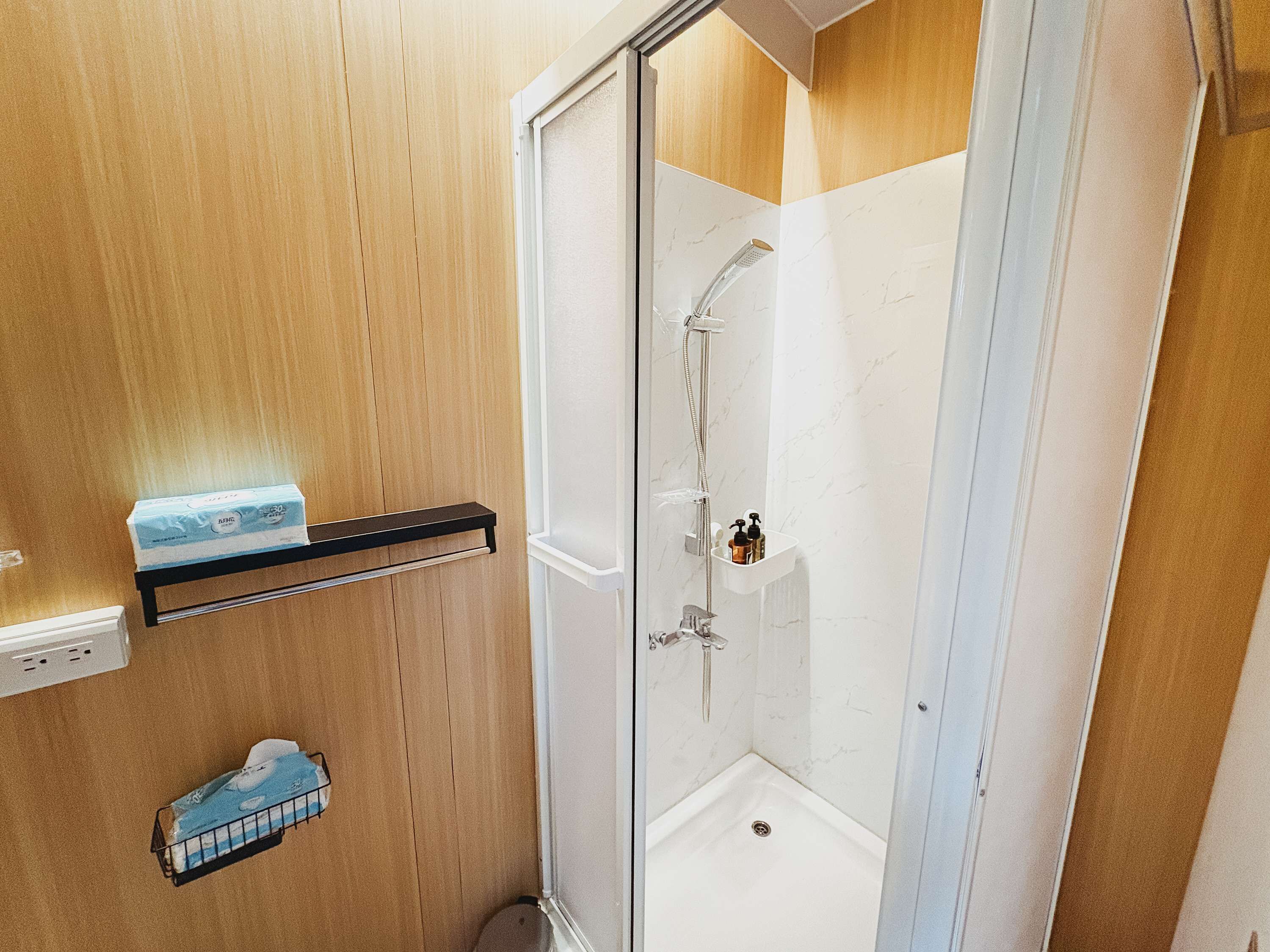 Shower, hair dryer, towels, shampoo