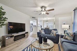 Smart TV, fireplace, table football, books