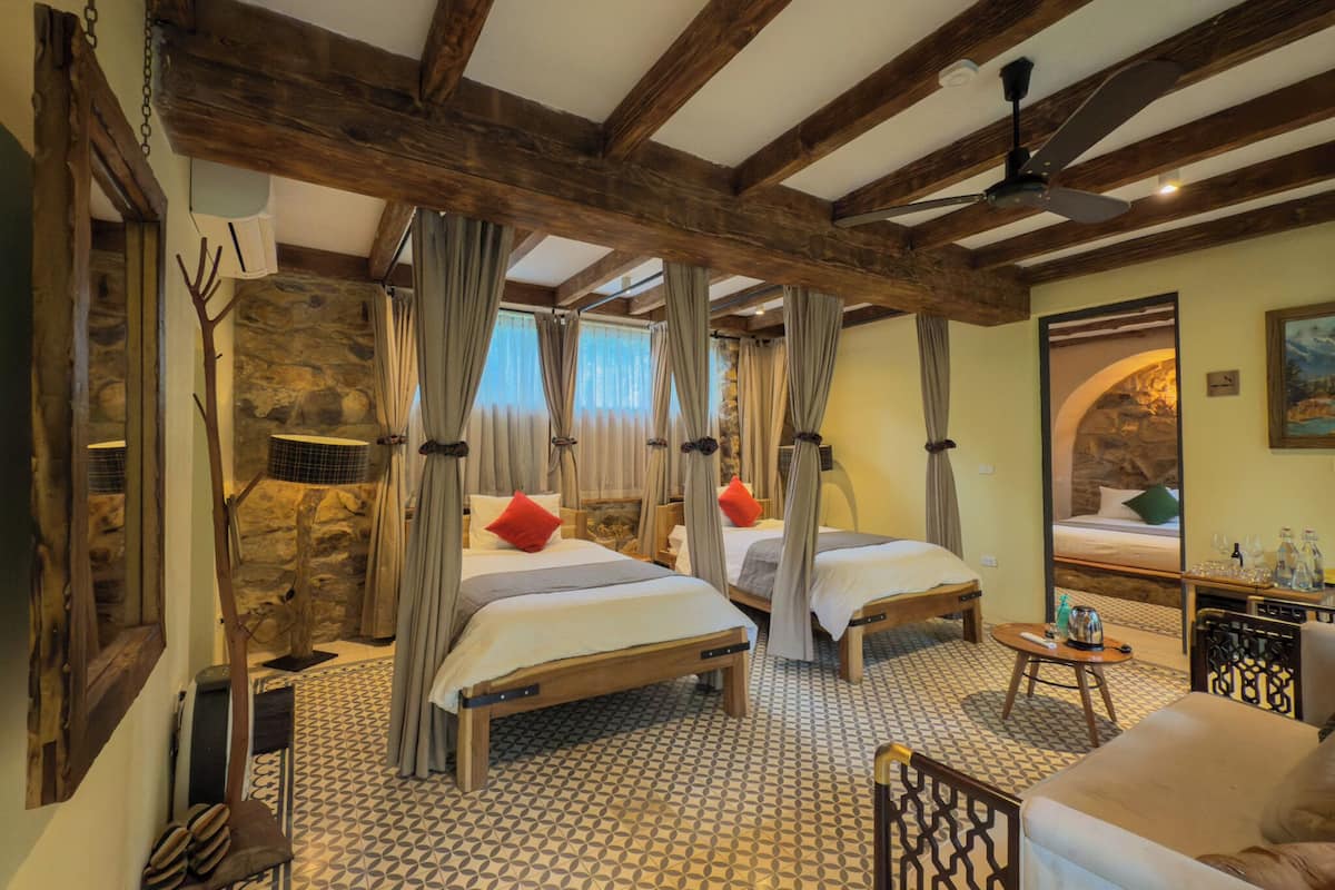 Family Suite, 2 Bedrooms, Patio, Pool View | In-room safe, blackout drapes