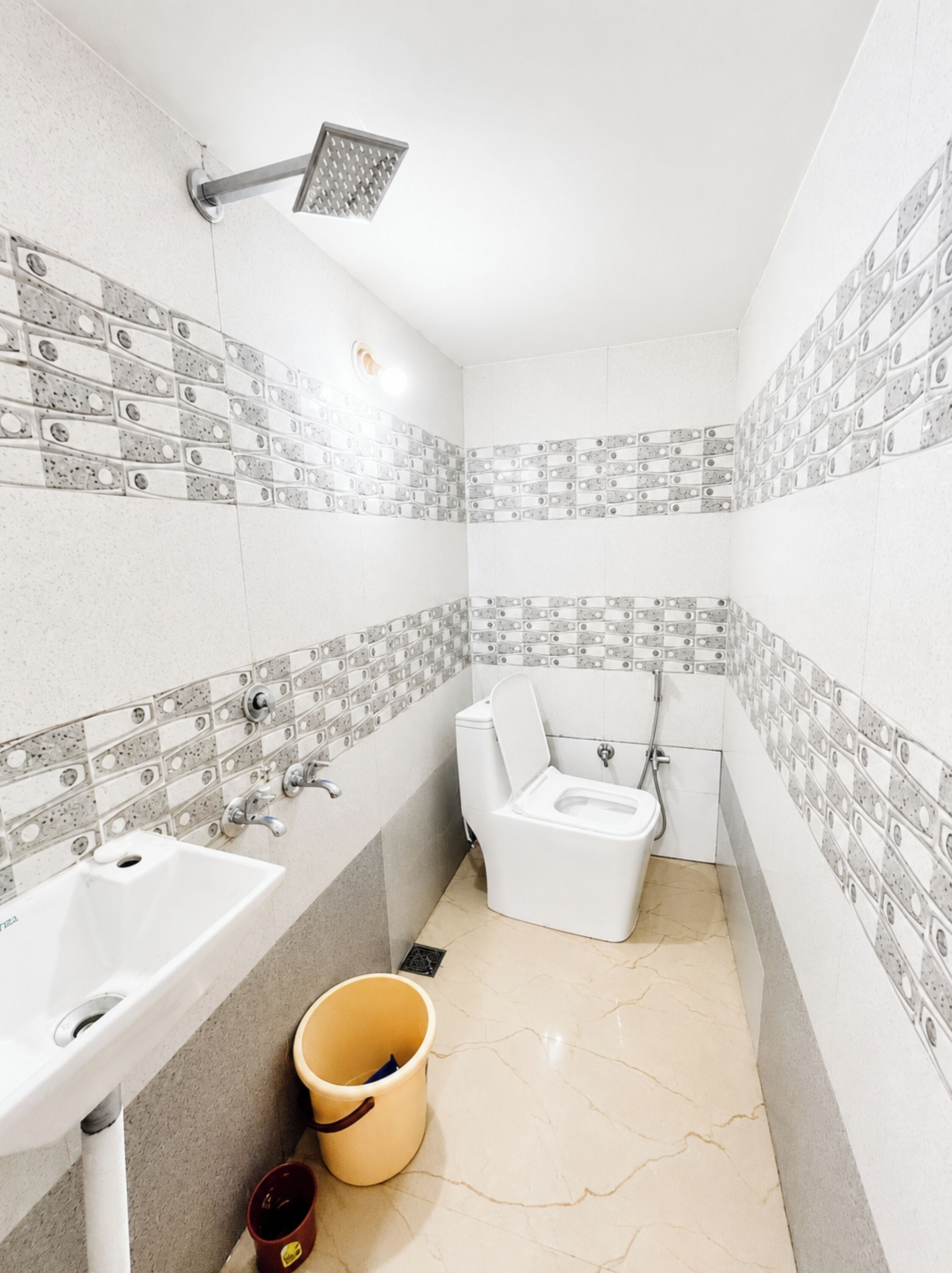 Shower, rainfall showerhead, slippers, towels