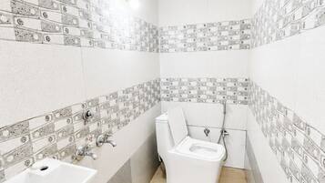 Shower, rainfall showerhead, slippers, towels