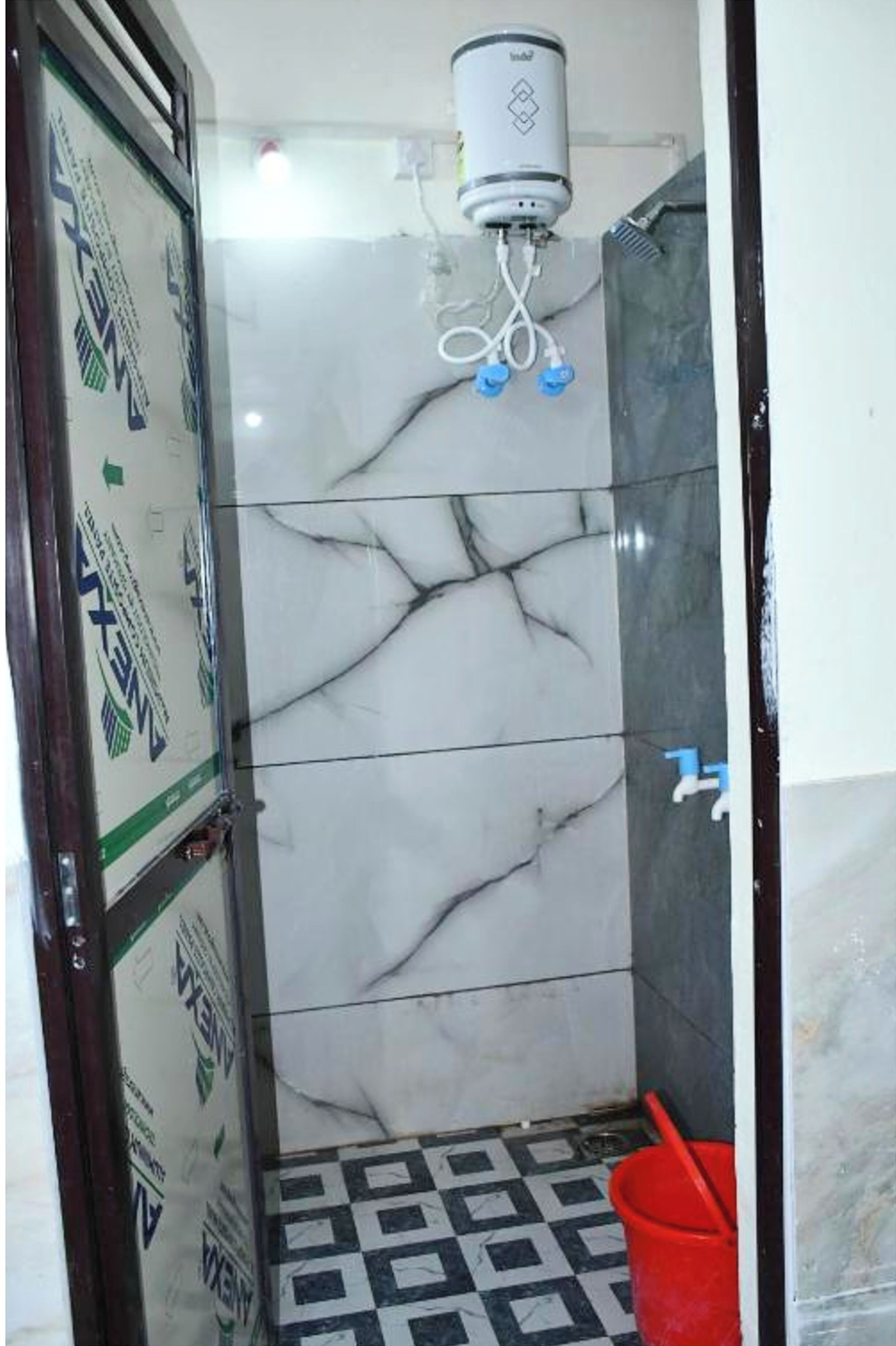 Shower, rainfall showerhead, slippers, towels