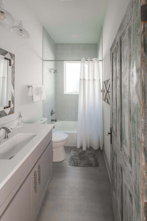 Shower, hair dryer, towels