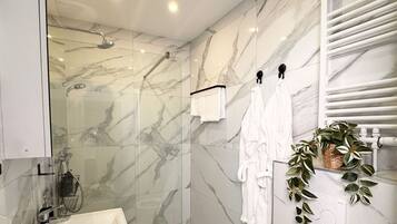 Shower, hair dryer, towels, soap