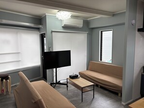 Family Apartment, Multiple Beds, Non Smoking, Kitchen | Living area | 43-inch flat-screen TV with digital channels