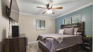 A bedroom with a bed, a ceiling fan, a dresser, and a window with blinds. - 3-bedroom pet friendly house with AC in Shady Spring- close to Winterplace! (Shady Spring)