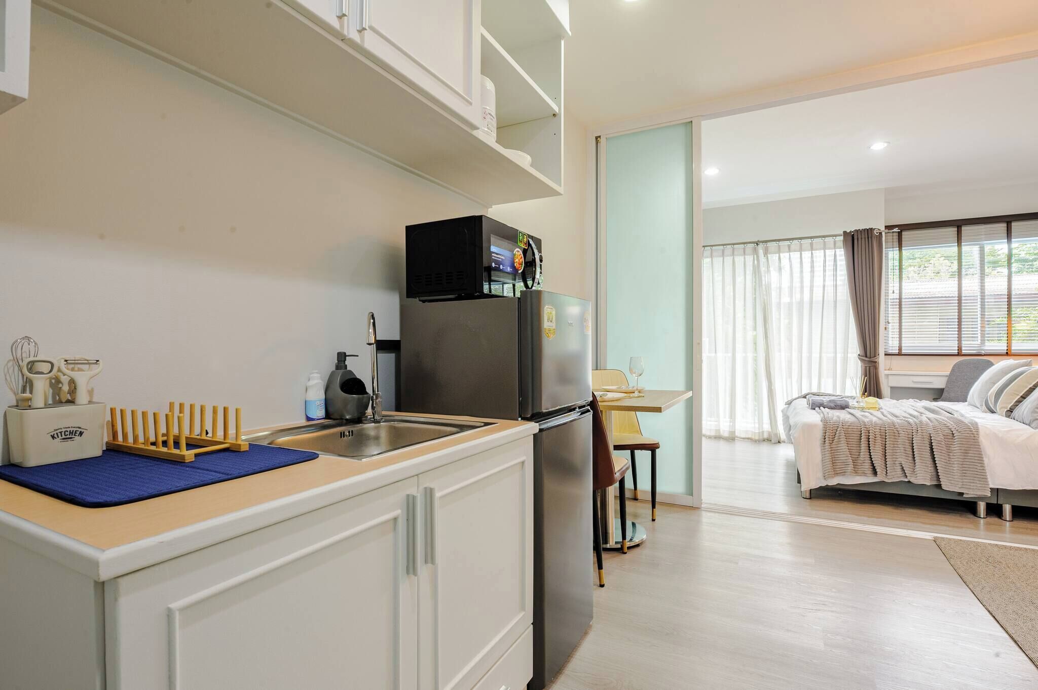 Fridge, microwave, toaster, cookware/dishes/utensils