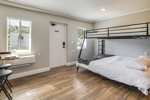 A room with a bunk bed, a desk with two chairs, and a window with blinds. - See the Manatees! Homosassa Studio 2 Mi to River (Homosassa)