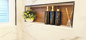 Shower, hair dryer, towels, soap