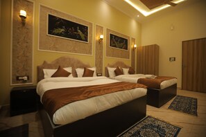 Family Quadruple Room | Desk, laptop workspace, soundproofing, iron/ironing board - Hotel Om Vilas (Mathura)