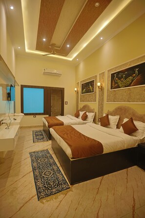 Family Quadruple Room | Desk, laptop workspace, soundproofing, iron/ironing board - Hotel Om Vilas (Mathura)