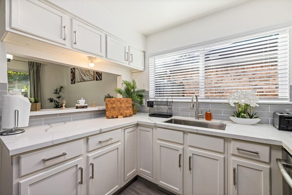 Fridge, microwave, oven, stovetop - Htown Hot Tub Getaway | Swing Set BBQ Yard Games (Houston)