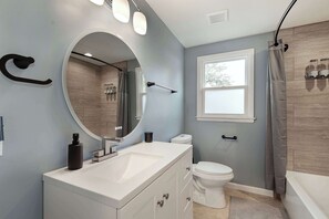 Shower, hair dryer, towels, shampoo