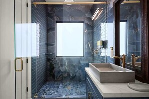 Shower, hair dryer, towels, shampoo