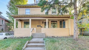 A two-story house with a front porch, a driveway, and a tree in the front yard. - 2 Mi to Dtwn! Walkable Minneapolis Apt w/ Deck (Minneapolis)