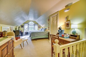 A bedroom with a bed, a desk, a chair, a dresser, and a window. - 1 Mi to Main St Fryeburg: Historic Family Home (Fryeburg)