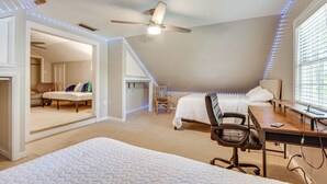 A bedroom with two beds, a desk, a chair, and a ceiling fan. - Walk to Dtwn Hahira: Inviting Home w/ Pool & Yard! (Hahira)