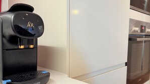 A black Philips coffee maker on a white countertop in a kitchen. - PrivateTerrace Opposite PiccadillyLine • 20min SOHO, Oxford Street & Sightseeing (Uxbridge)